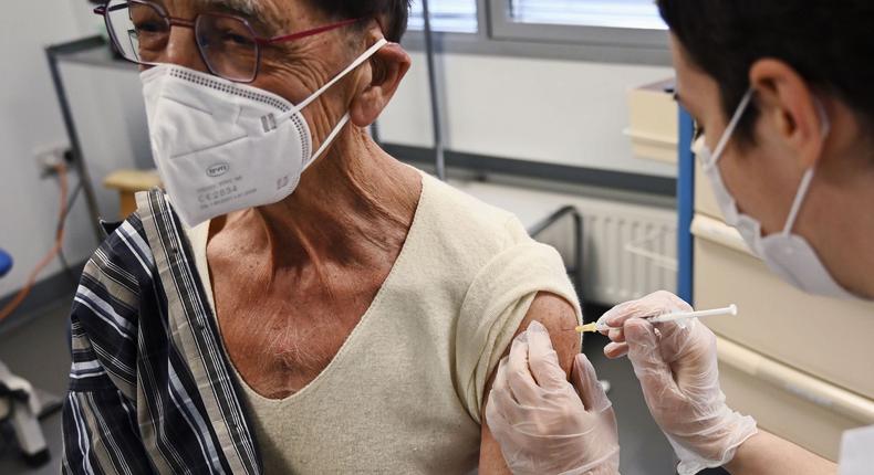 A doctor administers a second COVID-19 vaccine injection to a heart transplant recipient on February 20, 2021 at a hospital in Strasbourg, France.
