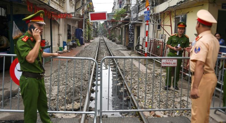The narrow railway corridor in central Hanoi had become a hotspot among visitors seeking the perfect holiday snap on the atracks - often dodging trains that rumble through daily