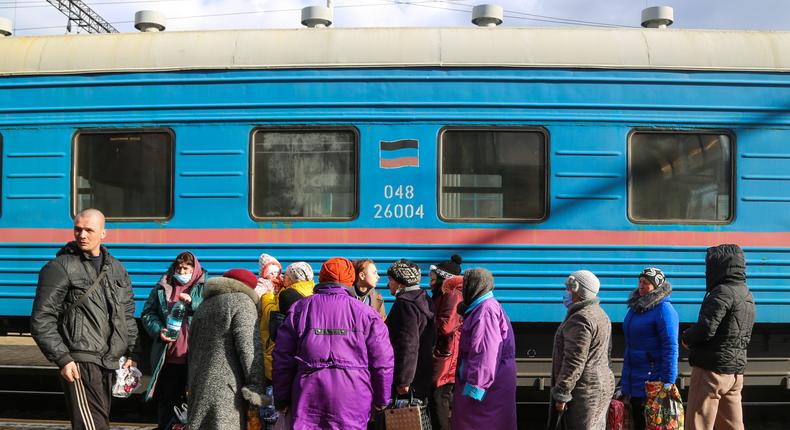 Citizens of the Donetsk People's Republic are seen outside a train at a railway station in Debaltsevo during a mass evacuation to Russia's Rostov-on-Don Region.