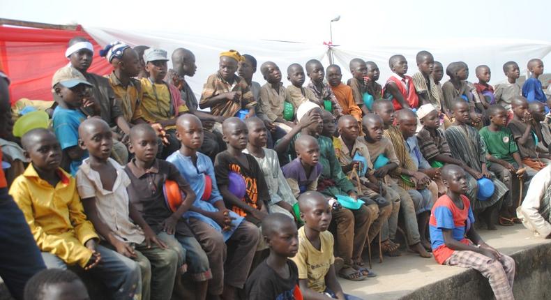 Homeless persons gather to watch a local wrestling match