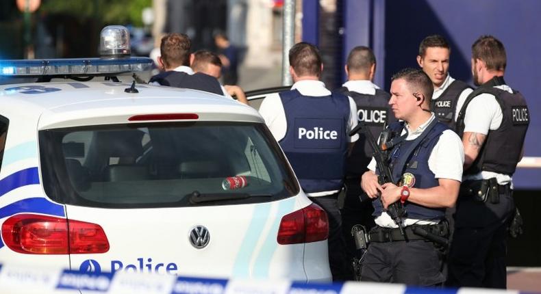 Belgian police secure the area around a police station in Charleroi following a machete attack on two policewomen on August 6, 2016 