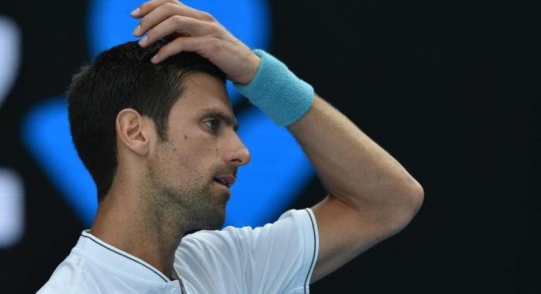Novak Djokovic crashed out to unheralded Denis Istomin in five sets on Thursday in the world number two's earliest exit from a major since Wimbledon 2008