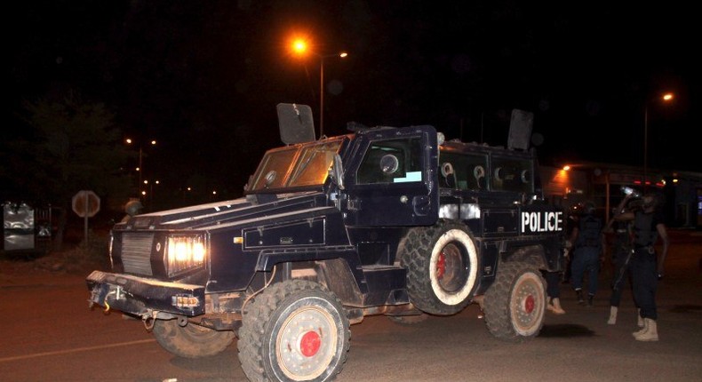 Malian police stand guard in an armored vehicle near the site of an attack on a hotel in Bamako that had been converted into the headquarters of a European Union military training operation, March 21, 2016. REUTERS/Adama Diarra