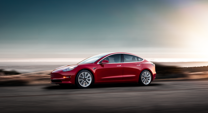 Tesla Model 3   Red Driving Sunset