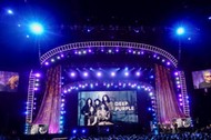 People listen to Gillan of Deep Purple speaks onstage at the 31st annual Rock and Roll Hall of Fame Induction Ceremony at the Barclays Center in Brooklyn