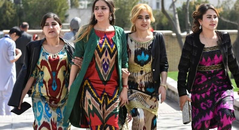 A growing number of Tajik women have been following a government recommendation to wear the Atlas and other traditional forms of dress