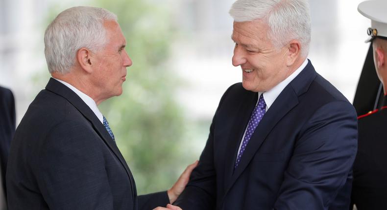 Vice President Mike Pence, left, shakes hands with Prime Minister of Montenegro Dusko Markovic, center, following their meeting at the White House in Washington, Monday, June 5, 2017.