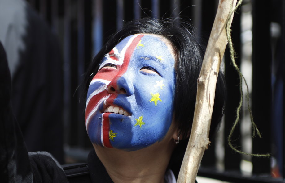 A woman looks upwards during a 'March for Europe' demonstration against Britain's decision to leave the European Union.
