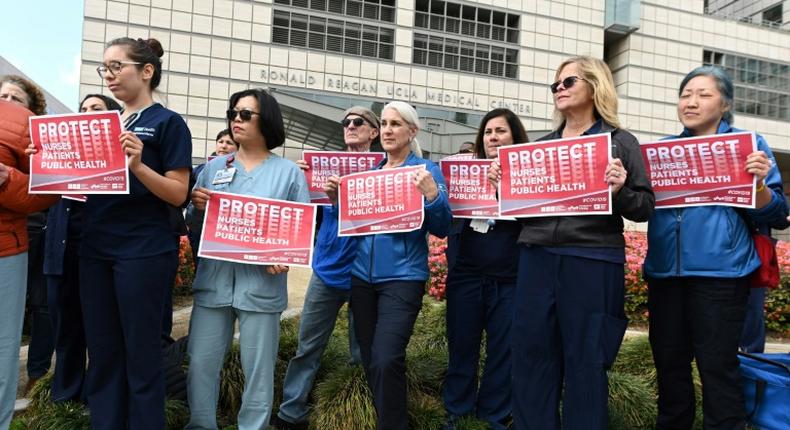 Nurses protest what they call the weak US response to the novel coronavirus outside the UCLA Medical Center in Los Angeles