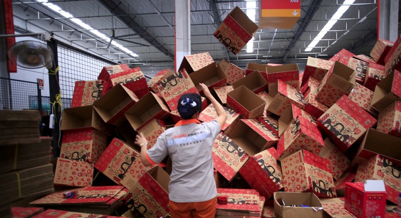 FILE PHOTO: An employee works at an Alibaba Tmall logistics centre in Suzhou, Jiangsu province, China, October 28, 2015. REUTERS/Aly Song/File Photo