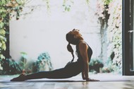 Portrait of gorgeous young woman practicing yoga indoor. Beautiful girl