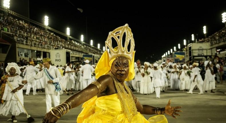 Revellers take part in a ceremony to purify the Sambadromo stadium on February 19, 2017, in preparation for Rio's carnival