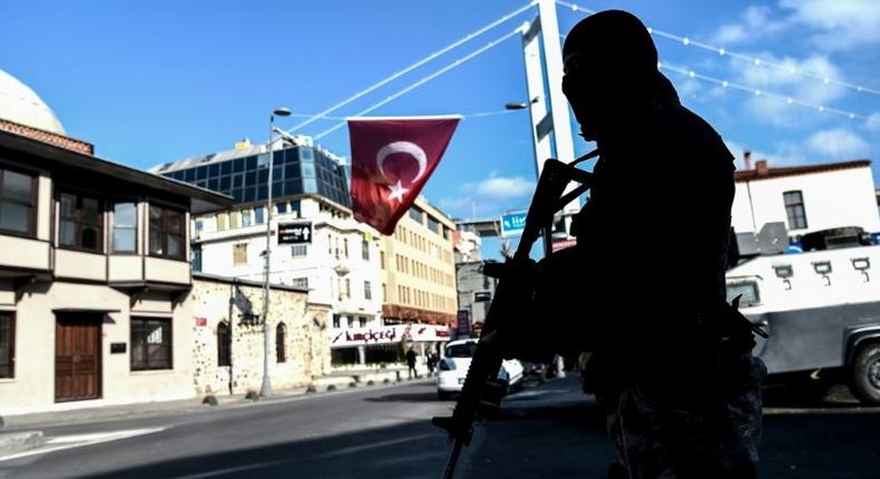 A Turkish special forces police officer stands guard near the Reina night club in Ortakoy district in Istanbul on January 2, 2017, one day after a gun attack at the club