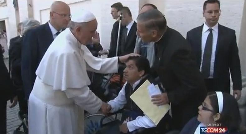 Pope Francis greets Angel V. in St Peter's Square before praying for him