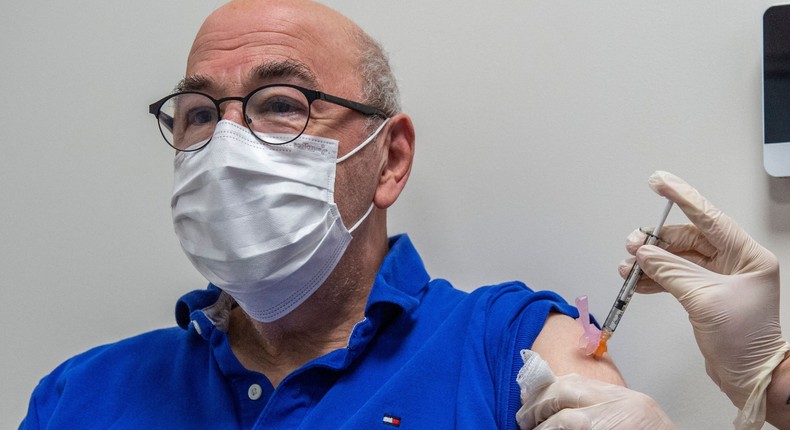 A man receives his booster shot with the Pfizer COVID-19 vaccine in Hartford, Connecticut.