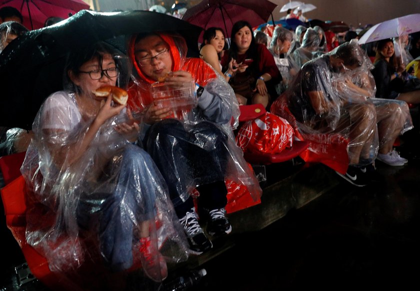 People celebrate the new year during a countdown event at Yongdingmen Gate in Beijing