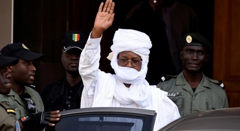 Former Chadian dictator Hissene Habre gesturing as he leaves a Dakar courthouse after an identity hearing on June 3, 2015