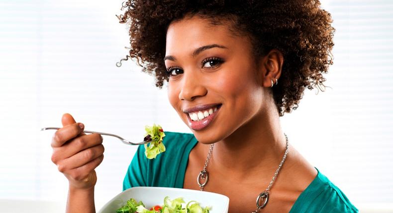 Woman eating vegetables(ebony)