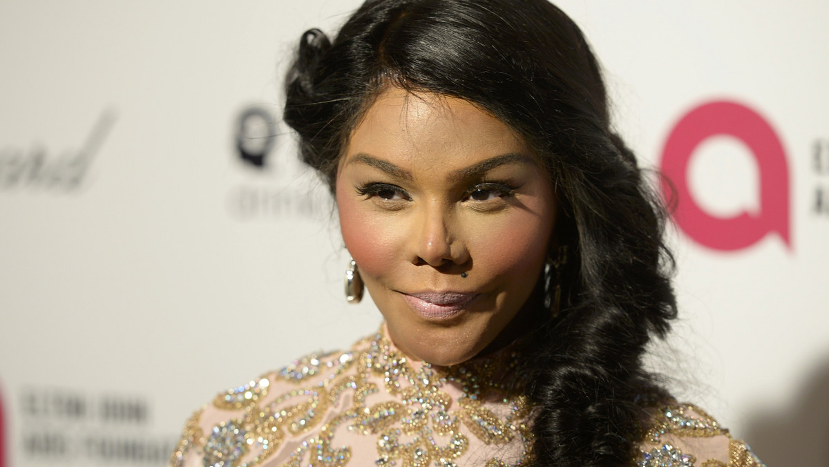 Rapper Lil' Kim arrives at the 2015 Elton John Aids Foundation Oscar Party in West Hollywood