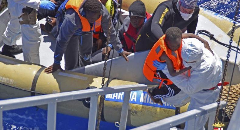 Migrants are seen during a rescue operation by Italian Navy vessels off the coast of Sicily in this April 11, 2016 handout picture provided by Marina Militare. 