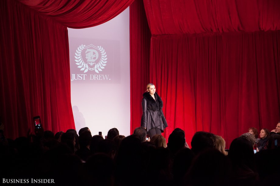 Actress Abigail Breslin opened the show in an all-black, fur-collared wrap jacket.