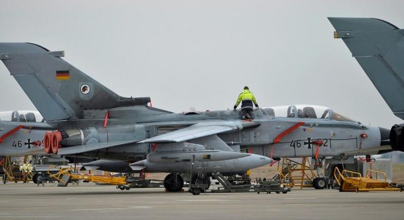 A technician works on a German Tornado jet at the air base in Incirlik, Turkey, on January 21, 2016