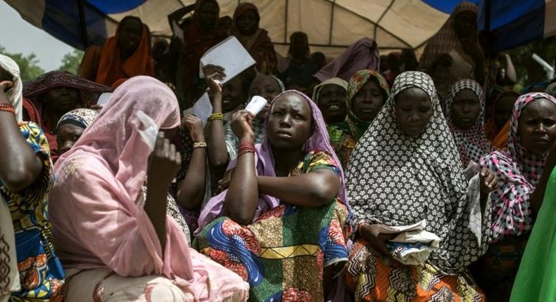 Women wait for food distribution in the town of Banki in northeastern Nigeria in April 2017 as conflict and the risk of famine heighten