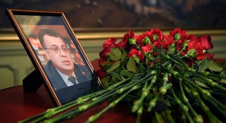 Flowers are placed in front of a photograph of the late Russian ambassador to Turkey, Andrei Karlov, at the Foreign Ministry in Moscow on December 20, 2016