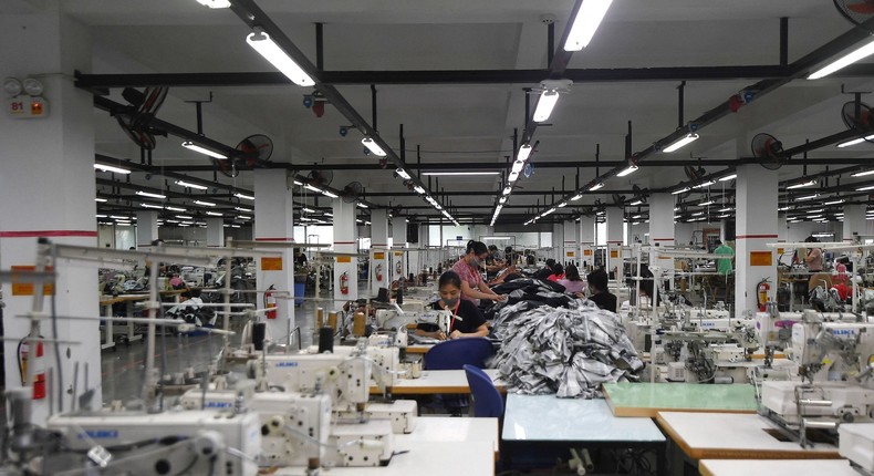 Workers working at a garment factory in Vietnam.
