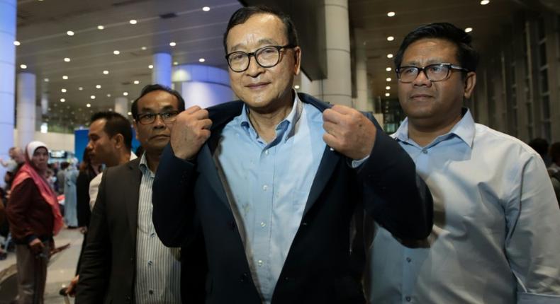 Cambodia's exiled opposition leader Sam Rainsy arrived in Malaysia after being barred in Paris from getting on a flight to Thailand