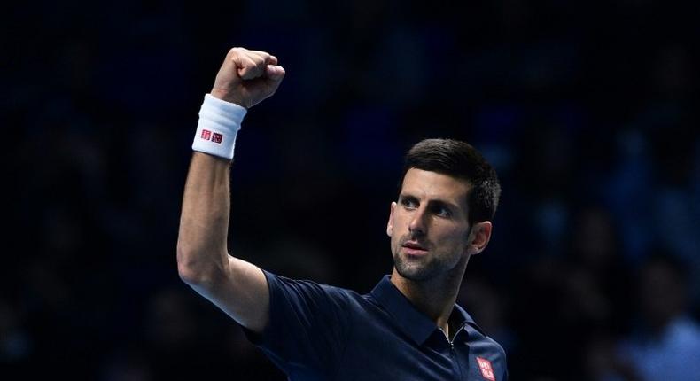 Serbia's Novak Djokovic celebrates beating Japan's Kei Nishikori during their men's semi-final singles match on day seven of the ATP World Tour Finals tennis tournament in London on November 19, 2016