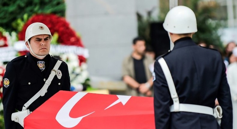 Turkish police stand next to the coffin of slain colleague Sinan Acar during his funeral ceremony in Istanbul on August 14, 2017