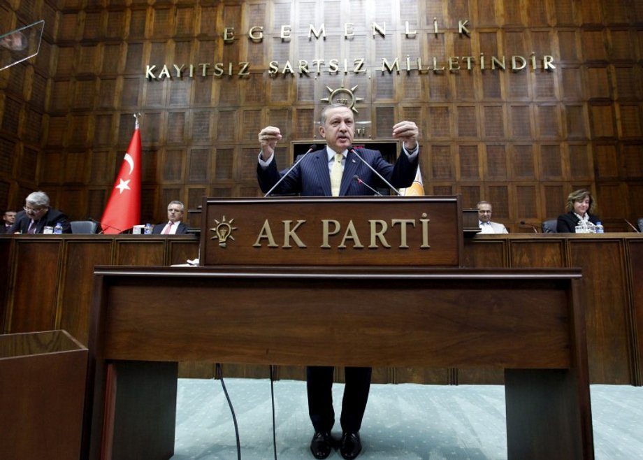 Turkey's Prime Minister Erdogan addresses members of parliament from his ruling AK Party, during a meeting at the Turkish parliament in Ankara