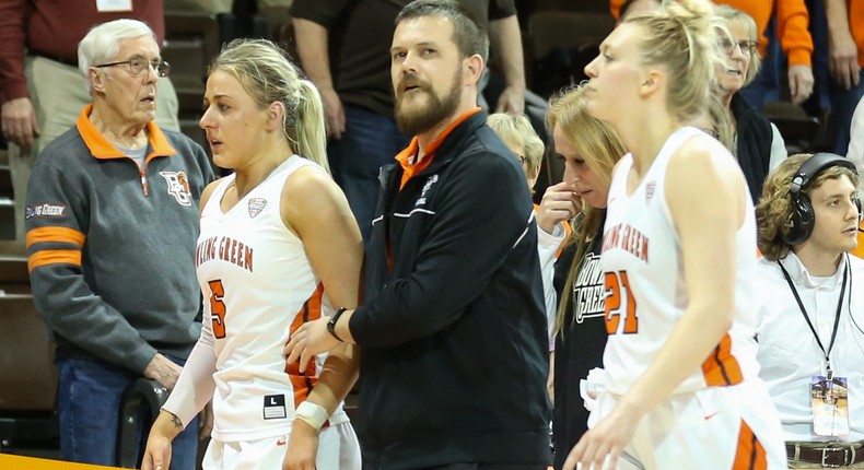 Bowling Green Falcons guard Elissa Brett (5), left, is assisted off of the court after an altercation with Memphis Tigers guard Jamirah Shutes (not pictured).Scott W. Grau/Icon Sportswire via Getty Images