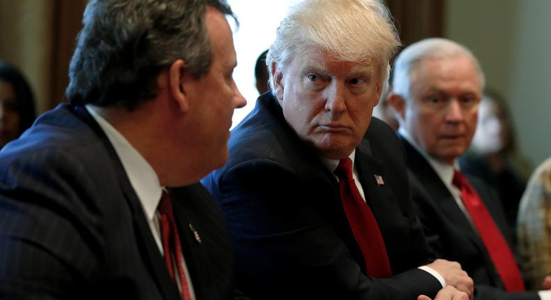 President Donald Trump (2nd L), flanked by New Jersey Governor Chris Christie (L), Attorney General Jeff Sessions (2nd R) and Education Secretary Betsy DeVos (R), holds an opioid and drug abuse listening session at the White House in Washington, U.S. March 29, 2017.