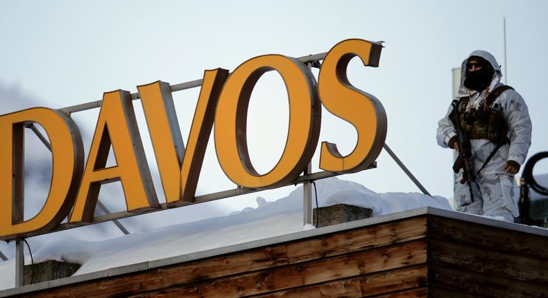 A police security guard patrols on the roof of a hotel ahead of the World Economic Forum in Davos, Switzerland, Monday, Jan. 20, 2020. The 50th annual meeting of the forum will take place in Davos from Jan. 21 until Jan. 24, 2020. (AP Photo/Markus Schreiber)