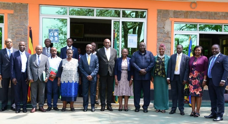 Masikye, Tayebwa and Baryomunsi in a group photo with other officials during the unveiling of a new university council