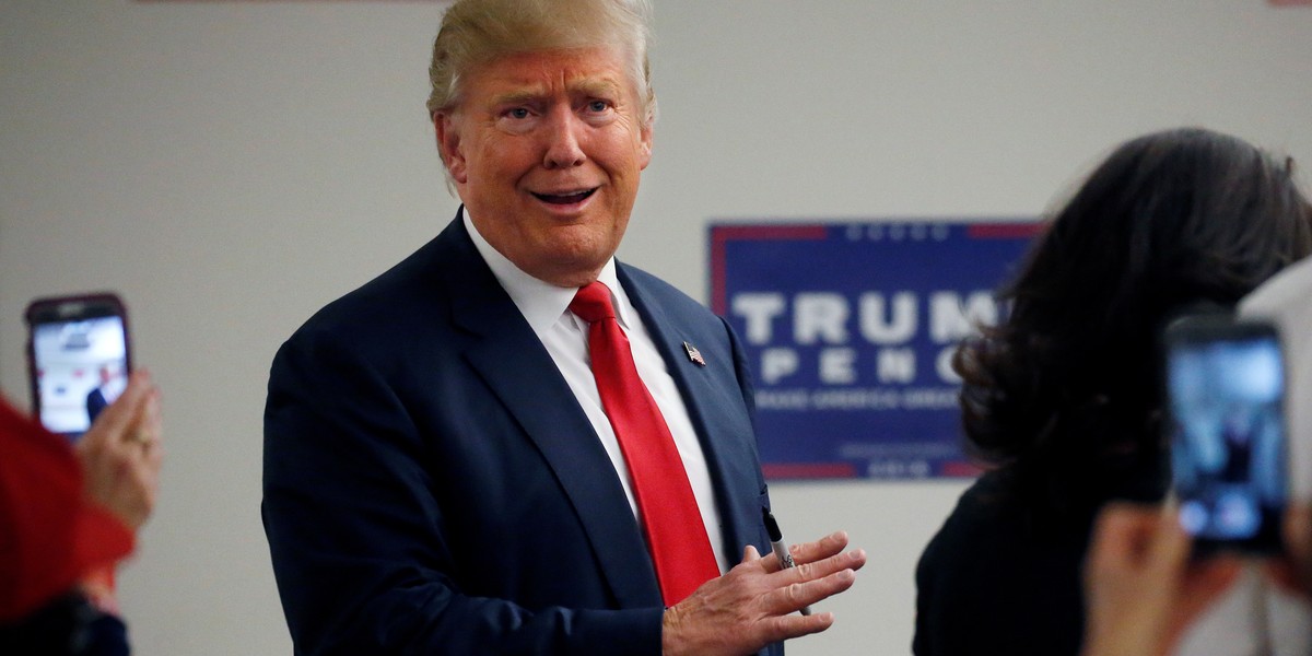 Donald Trump walks into a phone bank before a campaign rally in Greeley, Colorado, U.S. October 30, 2016.