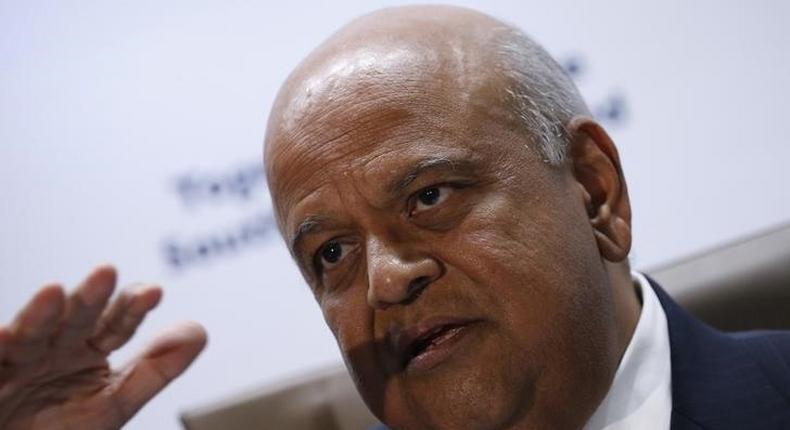 South Africa's Finance Minister, Pravin Gordhan gestures during a media briefing after he was reappointed to the position on Sunday night by President Jacob Zuma in Pretoria, South Africa December 14, 2015. REUTERS/Siphiwe Sibeko