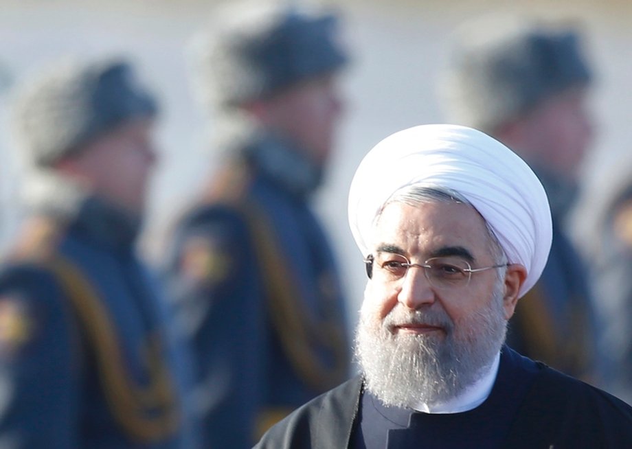 Iranian President Rouhani inspects honour guard during welcoming ceremony upon his arrival at Vnukovo International Airport in Moscow