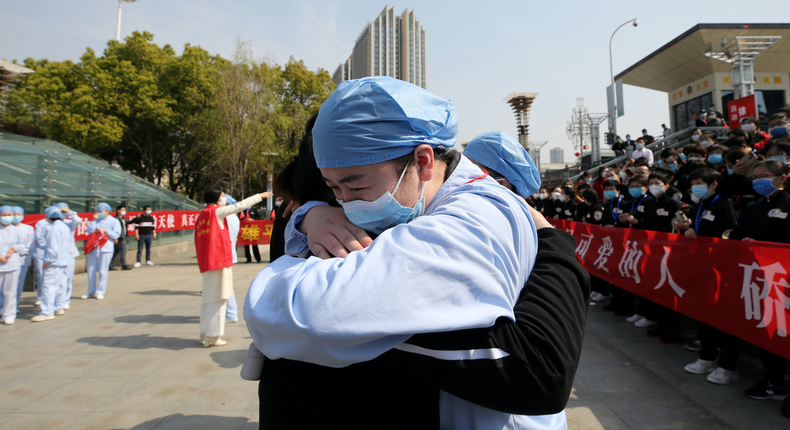 wuhan china thank you medical healthcare workers hug coronavirus recovered cases