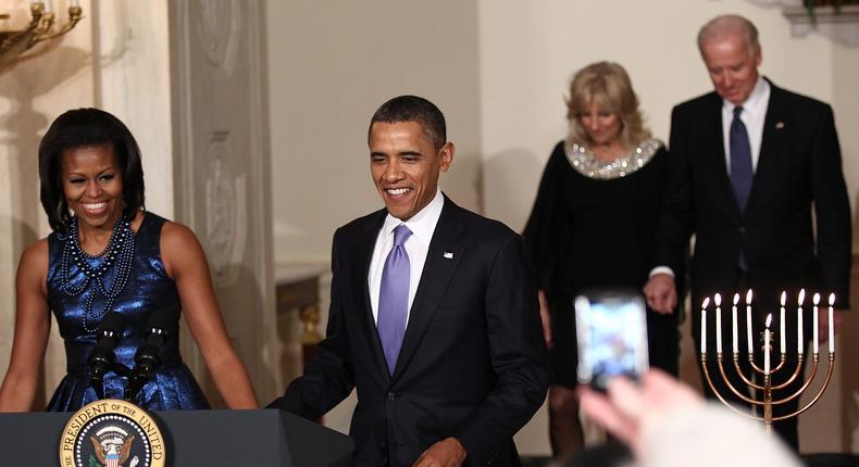 U.S. first lady Michelle Obama, U.S. President Barack Obama, Dr. Jill Biden, and U.S. Vice President Joe Biden arrive for remarks at the White House during a Hanukkah reception December 8, 2011 in Washington, DC.