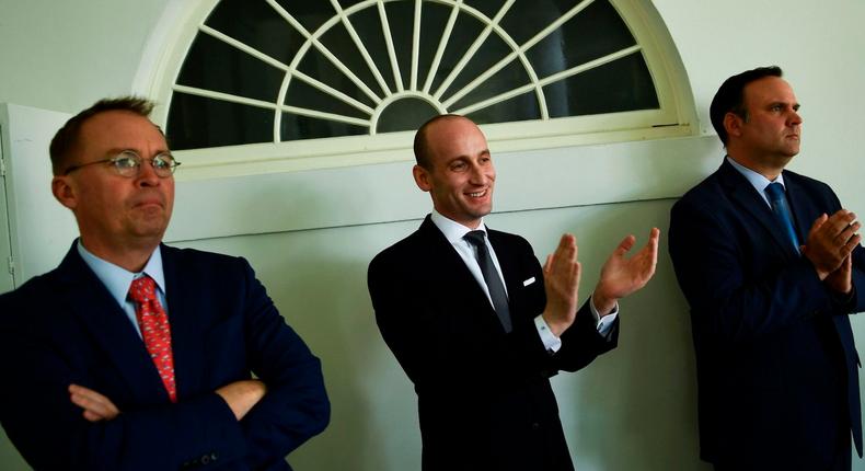 Stephen Miller (C), White House acting Chief of Staff Mick Mulvaney (L), and White House Social Media Director Dan Scavino