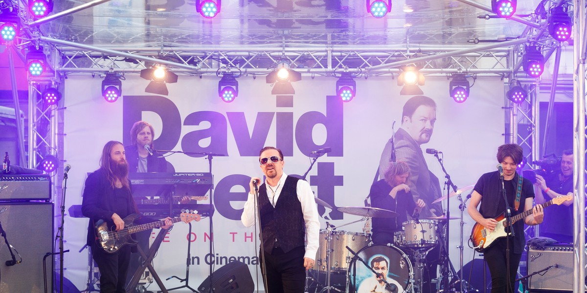 Gervais performs as David Brent with his band Foregone Conclusion.