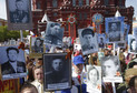 People take part in Immortal Regiment march with pictures of World War Two soldiers on Red Square during the Victory Day celebrations in Moscow