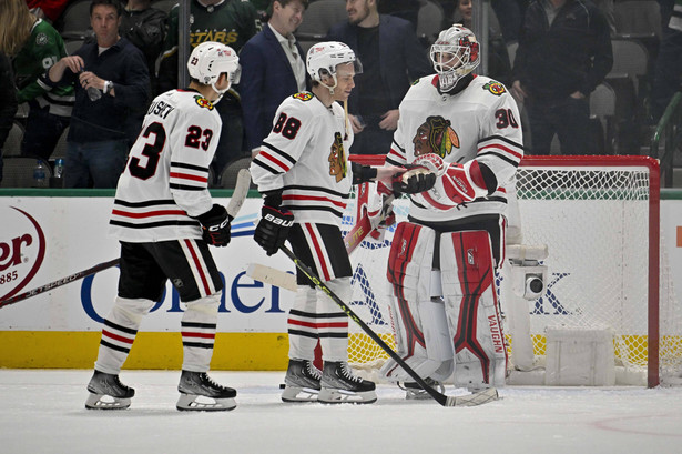Feb 22, 2023; Dallas, Texas, USA; Chicago Blackhawks center Philipp Kurashev (23) and right wing Patrick Kane (88) and Chicago Blackhawks goaltender Jaxson Stauber (30) skate off the ice after the Blackhawks victory over the Dallas Stars at the American Airlines Center. Mandatory Credit: Jerome Miron-USA TODAY Sports/Sipa USA HOKEJ NA LODZIE LIGA NHL FOT. SIPAUSA/NEWSPIX.PL POLAND ONLY !!! --- Newspix.pl *** Local Caption *** www.newspix.pl mail us: info@newspix.pl call us: 0048 022 23 22 222 --- Polish Picture Agency by Ringier Axel Springer Poland