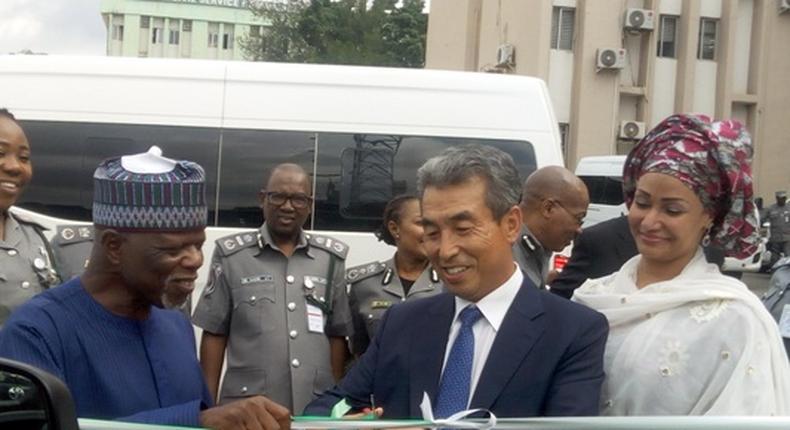 Mr Lee In Tae, Ambassador of the Republic of Korea to Nigeria delivering vehicles to Hameed Ali,NCS Comptroller-General (NAN)