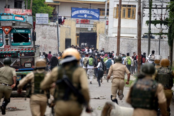 The Wider Image: Kashmir's stone-pelters face off against pellet guns