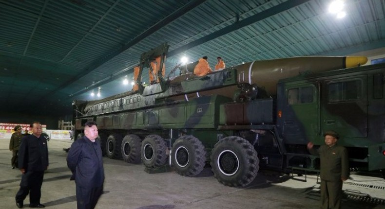 North Korean leader Kim Jong Un inspects the intercontinental ballistic missile Hwasong-14 in this undated photo released by KCNA