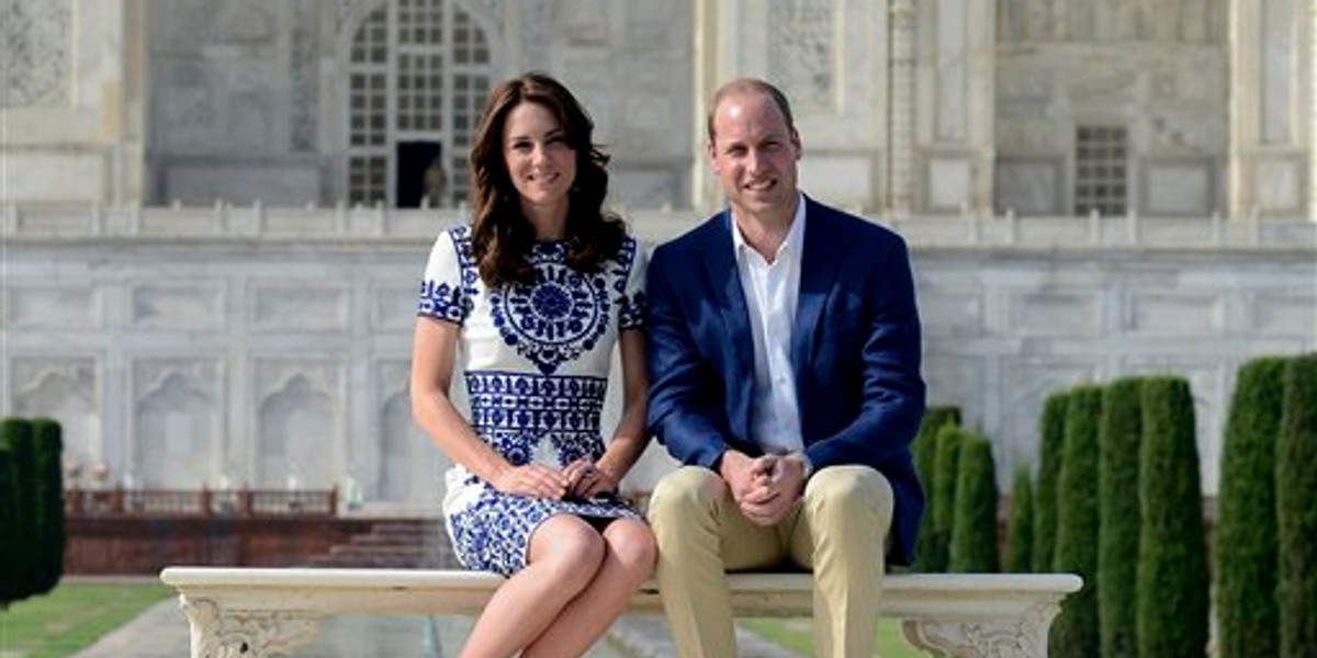 Britain's Prince William, along with his wife, Kate, the Duchess of Cambridge, pose in front of the Taj Mahal in Agra, India, Saturday, April 16, 2016. Agra is the last stop on the royal couple's weeklong visit to India and neighboring Bhutan. (Money Sharma/ Pool photo via AP)